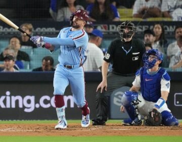 Philadelphia Phillies' Kyle Schwarber follows his solo home run off Los Angeles Dodgers starting pitcher Yoshinobu Yamamoto during the fourth inning in Game 3 of baseball's National League Division Series Wednesday, Oct. 8, 2025, in Los Angeles.