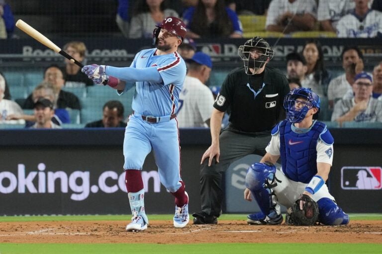 NLDS Phillies Dodgers Baseball Philadelphia Phillies' Kyle Schwarber follows his solo home run off Los Angeles Dodgers starting pitcher Yoshinobu Yamamoto during the fourth inning in Game 3 of baseball's National League Division Series Wednesday, Oct. 8, 2025, in Los Angeles.