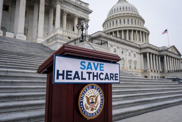 Congress Shutdown Save Healthcare sign outside U.S. Capitol