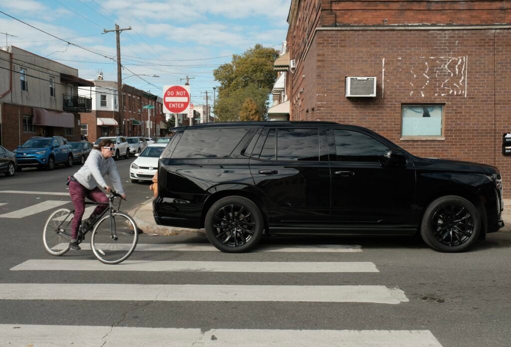 Cars frequently block curb cuts and crosswalks