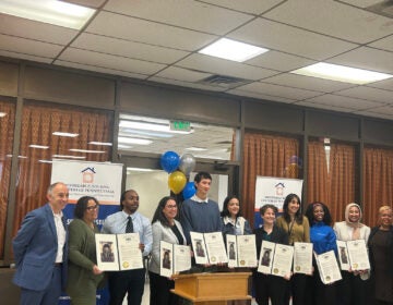 Staffers with the Will Power Program gathered Wednesday to celebrate the initiative helping 1,000 homeowners. (Aaron Moselle/WHYY)