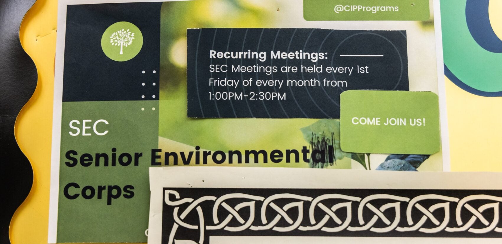 a sign for the Senior Environment Corps says meetings are held every first friday of every month from 1 to 2:30 pm