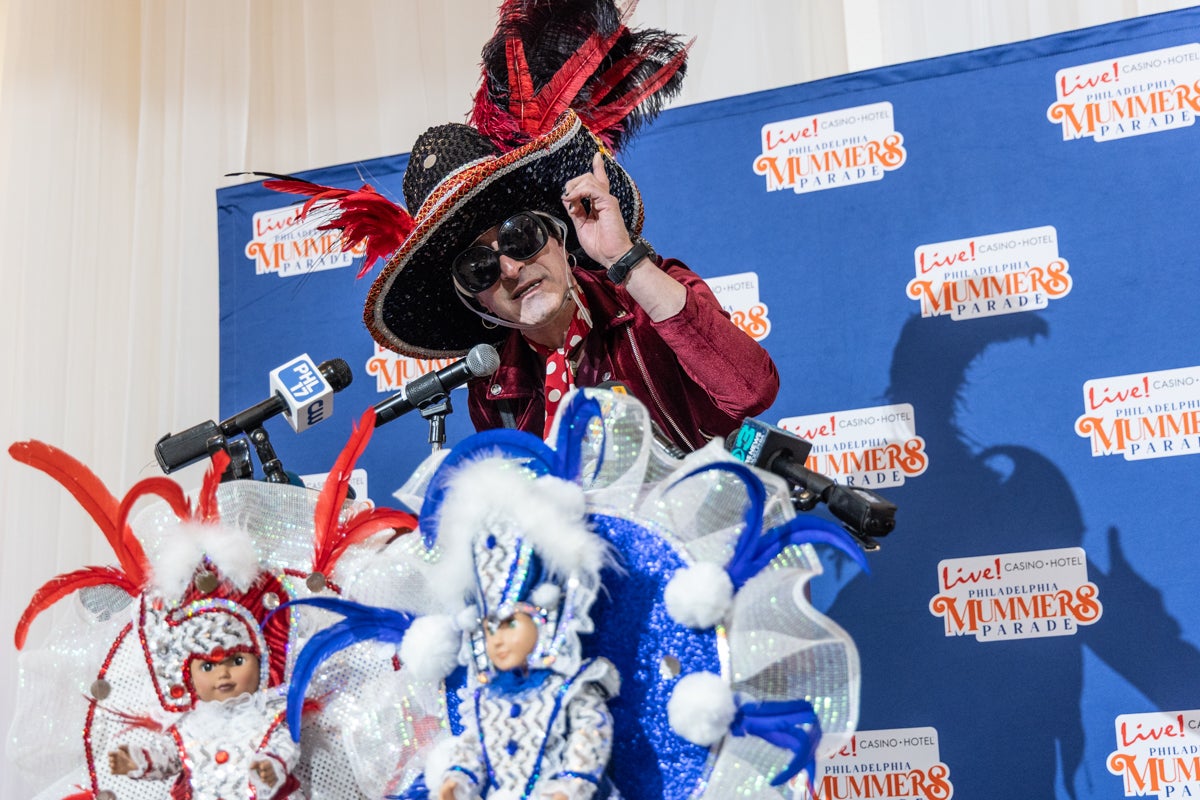WMMR DJ and long-time Mummer, Jacky BamBam, helped announce the details of the 2026 Philadelphia Mummers Parade at a press conference at the Mummers Museum on Nov. 20, 2025. (Kimberly Paynter/WHYY)
