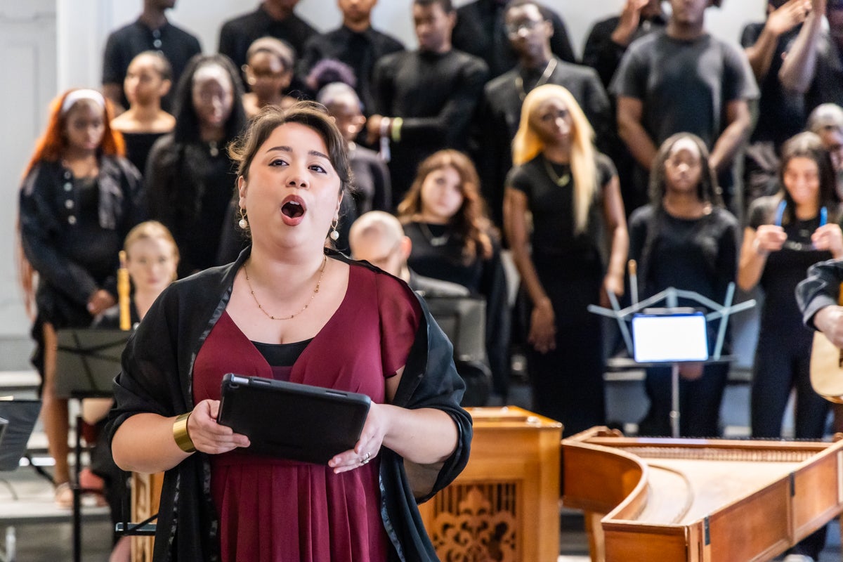 Mezzo-soprano Gabriela Estefanie Solís solos during rehearsal with the Tempesta di Mare Baroque orchestra and the Girard College ensemble