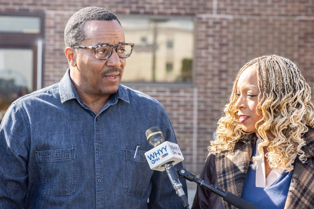 Stefan Roots speaking into a microphone