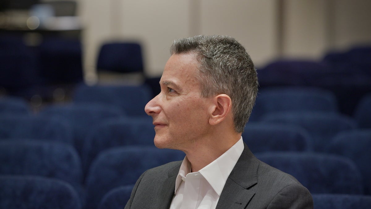 Jeffrey Rosen looks on