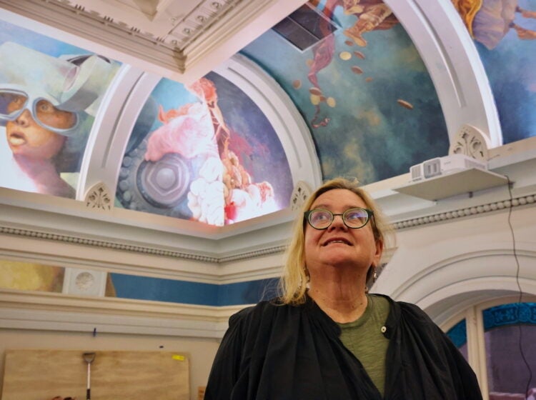 Meg Saligman looks up at the painted ceiling in the ''Ministry of Awe
