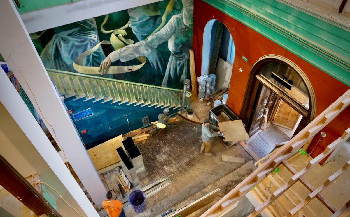 Construction workers and artists transforming Manufacturers National Bank in Old City into the ''Ministry of Awe