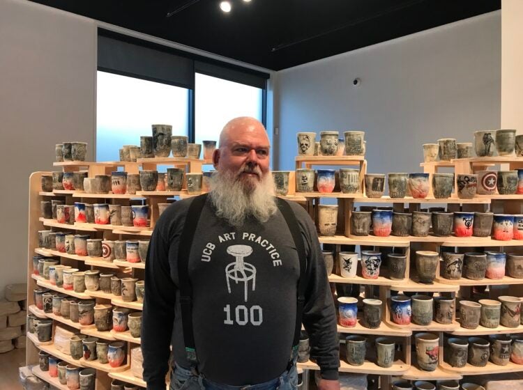 Marine Corps veteran and ceramic artist Ehren Tool shows his artwork displayed at the 