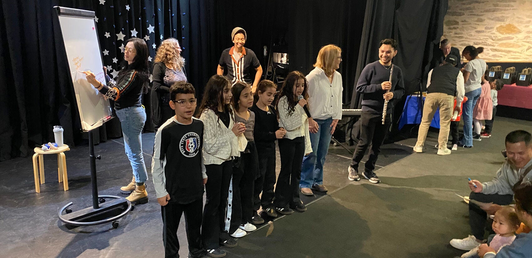 Professional musicians lead a songwriting workshop with kids and families at the Please Touch Museum’s Wonder Theater.