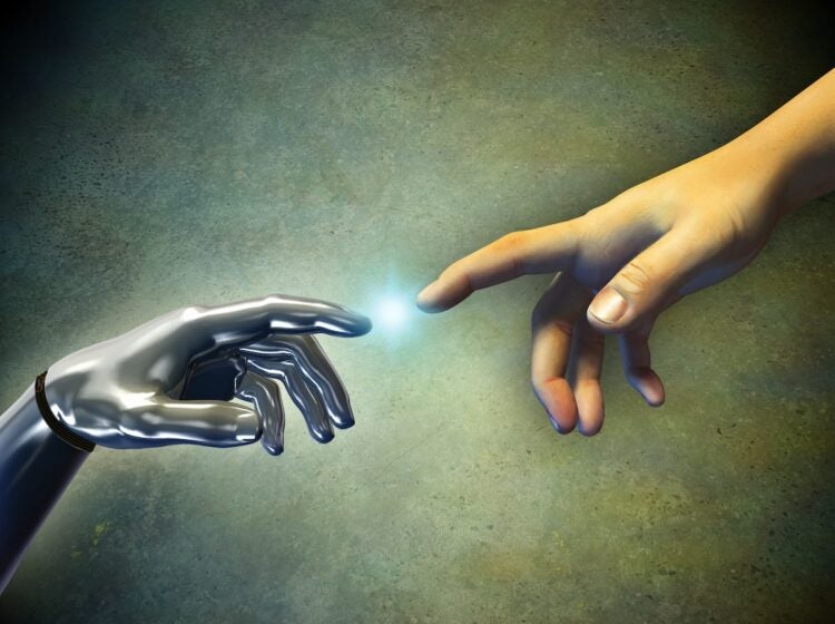 Human hand touching an android hand. (Thufir/Bigstock)