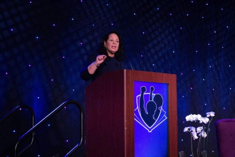 Dr. Leslie Fenwick speaks at a podium