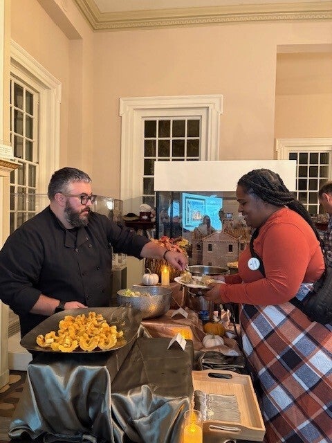 Someone serving food to another person