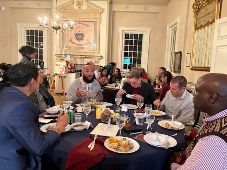 People sitting around a large round table eating