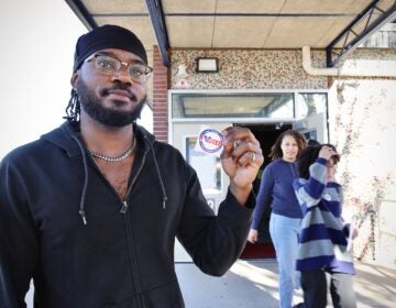 election-day-willingboro-new-jersey-polling-place-voters-EL-04-110425 Willingboro resident Hezekiah Sara shows off his viting sticker after casting his ballot at Stuart Elementary School.