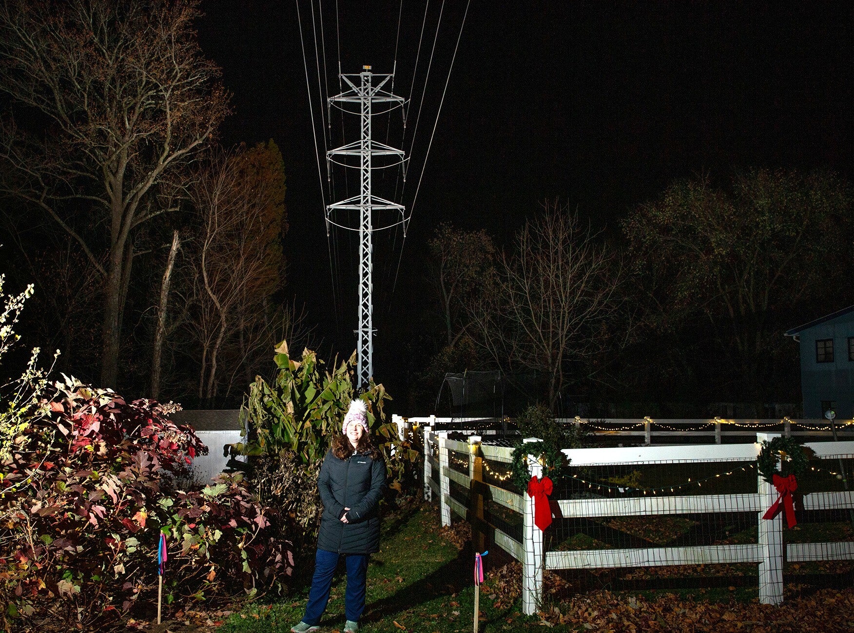 Melissa Parsonson standing in front of the power lines