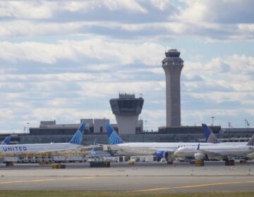Government Shutdown Airlines Planes in front of air traffic control tower at Newark International Airport