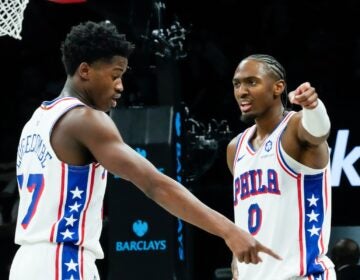 Philadelphia 76ers' VJ Edgecombe, left, talks to Tyrese Maxey (0)