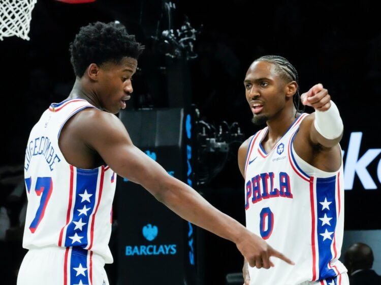 Philadelphia 76ers' VJ Edgecombe, left, talks to Tyrese Maxey (0)
