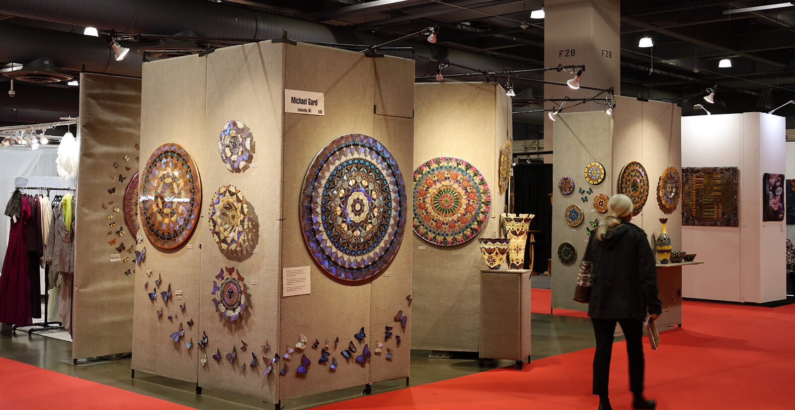 A person walks around a floor of various art pieces in Philadelphia