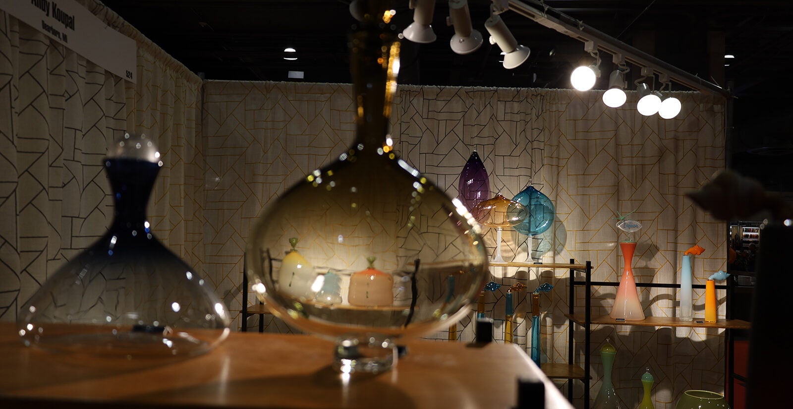 Various glass art works sit on display