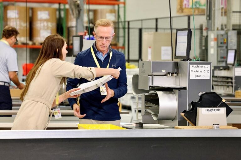 Election workers scan ballots at the City of Philadelphia Election Warehouse in North Philadelphia.