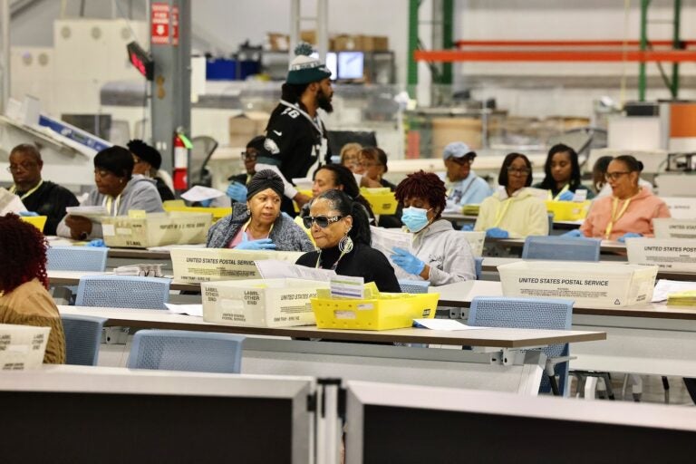 Election workers prepare ballots for scanning at the City of Philadelphia Election Warehouse in North Philadelphia.