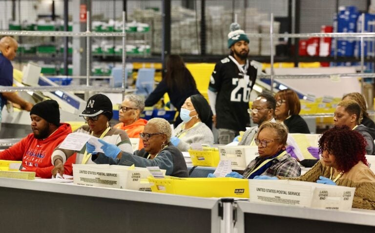 Election workers prepare ballots for scanning at the City of Philadelphia Election Warehouse in North Philadelphia.