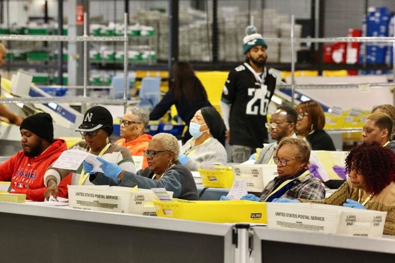 Election workers prepare ballots for scanning at the City of Philadelphia Election Warehouse in North Philadelphia.