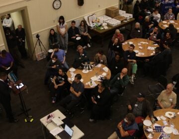 Dozens of transit advocates sitting down