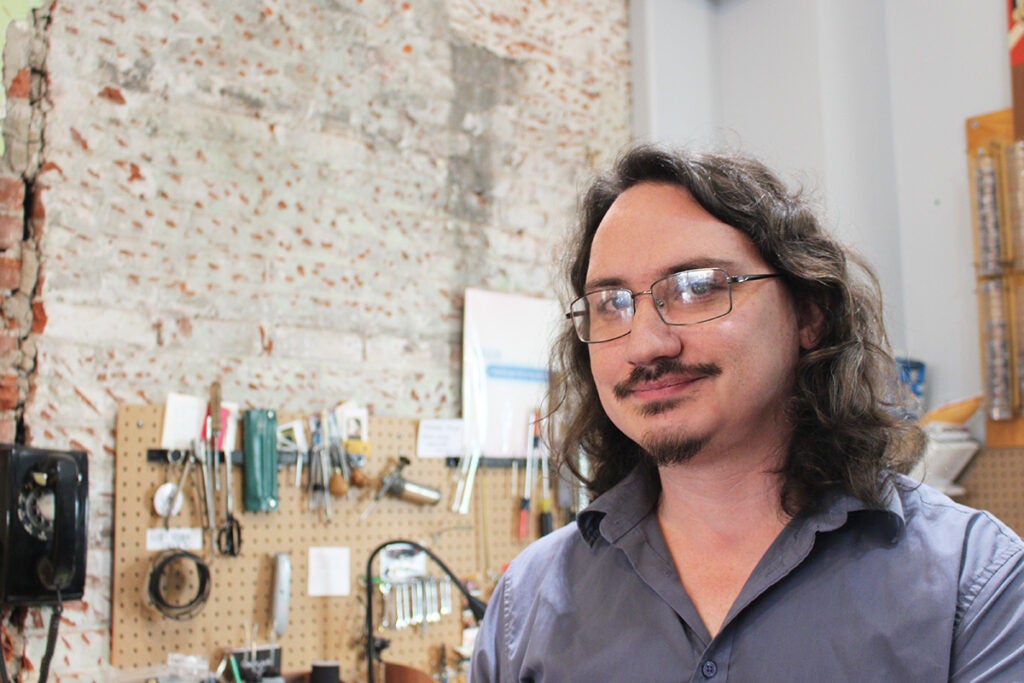 Bill Rhoda, the co-owner of Philly Typewriter, smiles at the camera