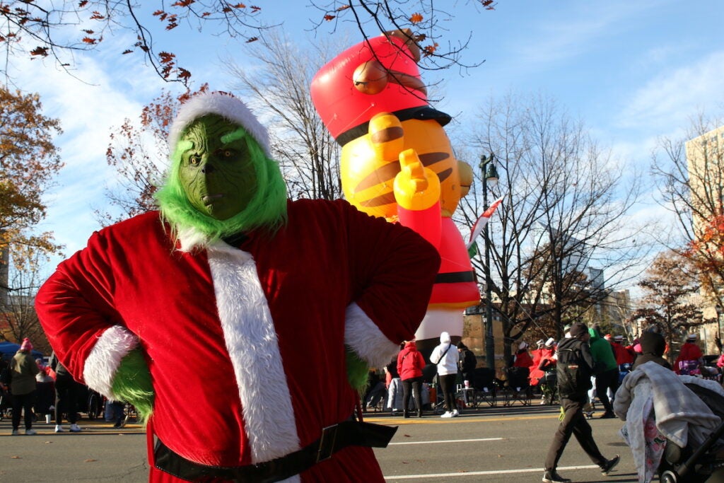 Man in Grinch costume at 2025 Thanksgiving Day Parade