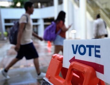 Election 2025 Race Calls People walk past a