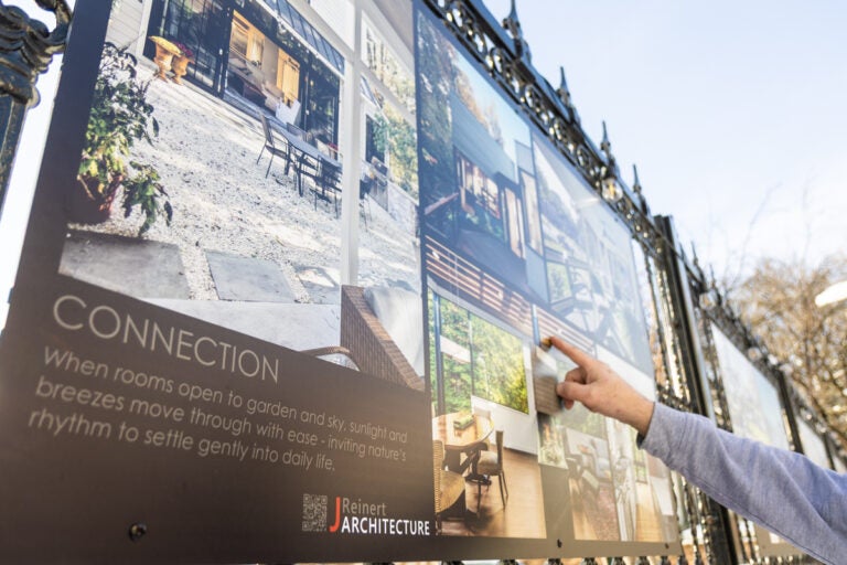 Jay Reinert pointing to an aspect of design he created for the Art Walk