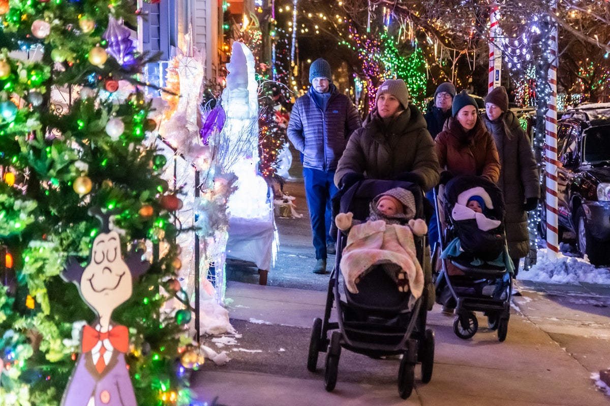 Families enjoy the Miracle on South 13th Street light display in South Philadelphia