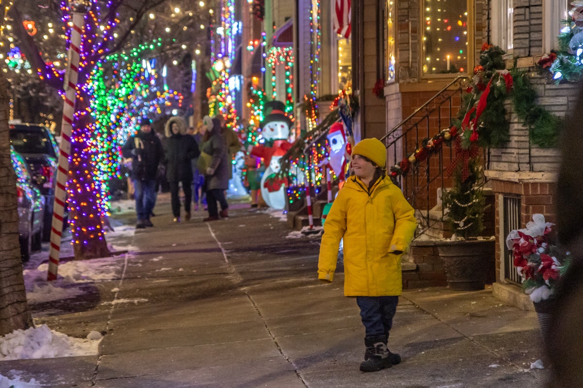 Families enjoy the Miracle on South 13th Street light display in South Philadelphia
