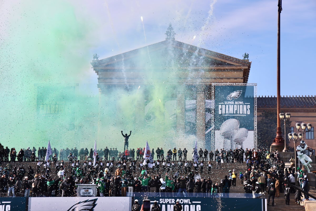 Fireworks go off behind the Philadelphia Art Museum steps, during the Eagles' Super Bowl victory celebration. Massive banners hang on the front of the museum saying 'Super Bowl Champions.'