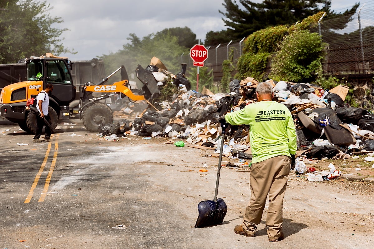 Community Life Improvement Program workers cleared trash off of Wyalusing Ave. near 50th Street in Philadelphia and pushed it into a massive overflowing pile on day 6 of a municipal services worker strike, July 7, 2025.
