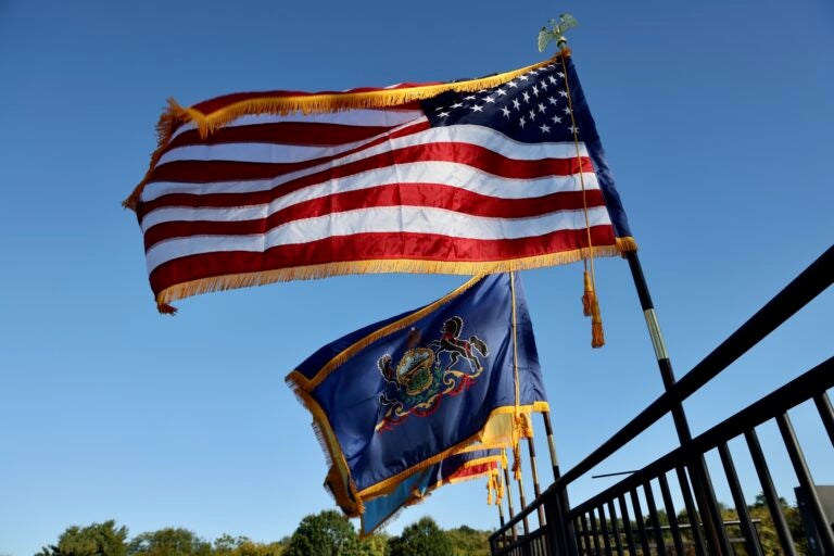 Flags fly at the Philadelphia Navy Yard in celebration of the 250th anniversary of the United States Navy and Marine Corps.