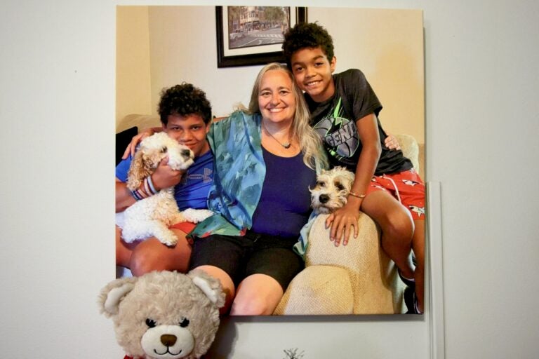 A family poses for a photo with their dogs