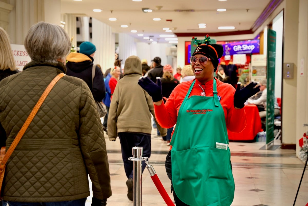 Greeter welcomes visitors to the Wanamaker Building in center city