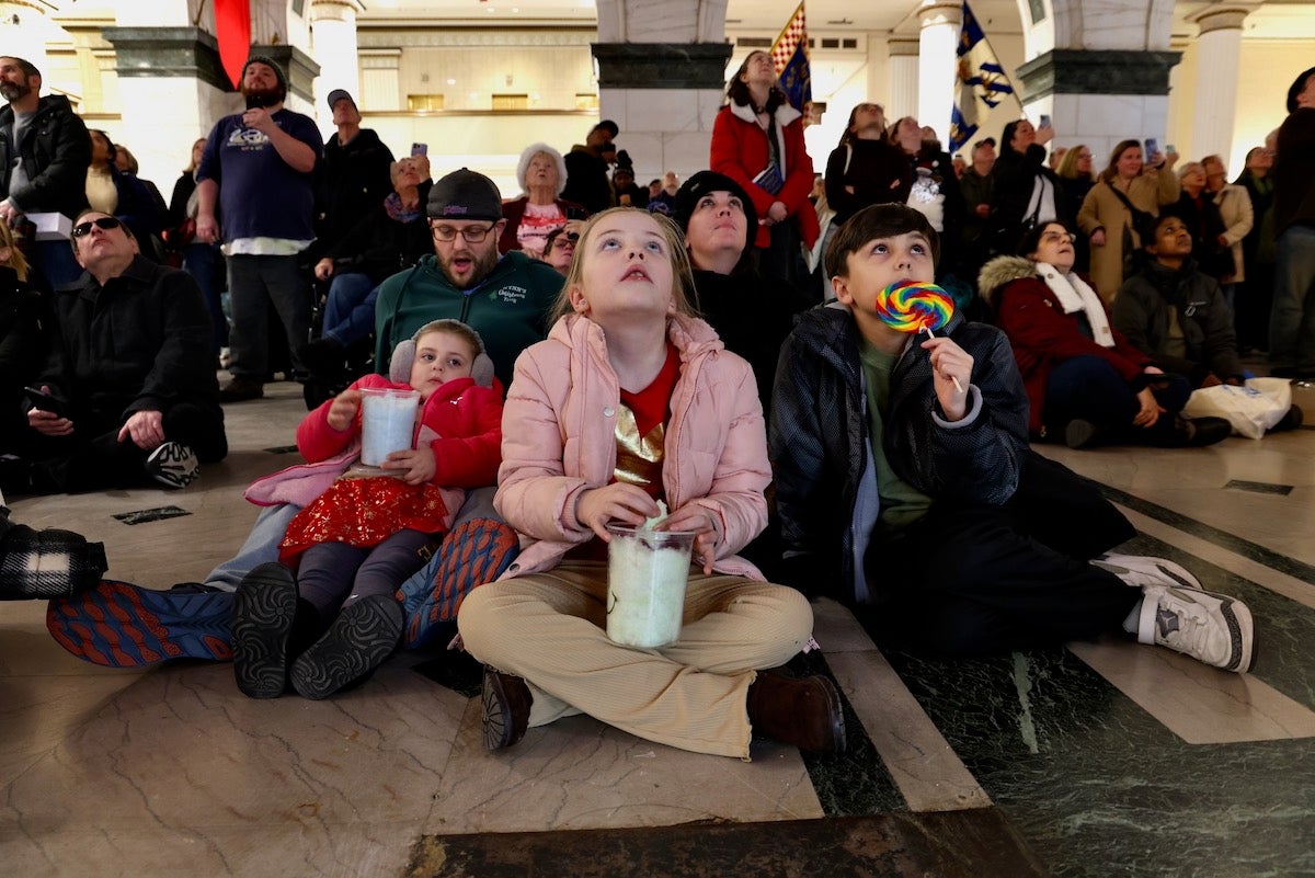 Children watching the Christmas Light Show at the Wanamaker Building.