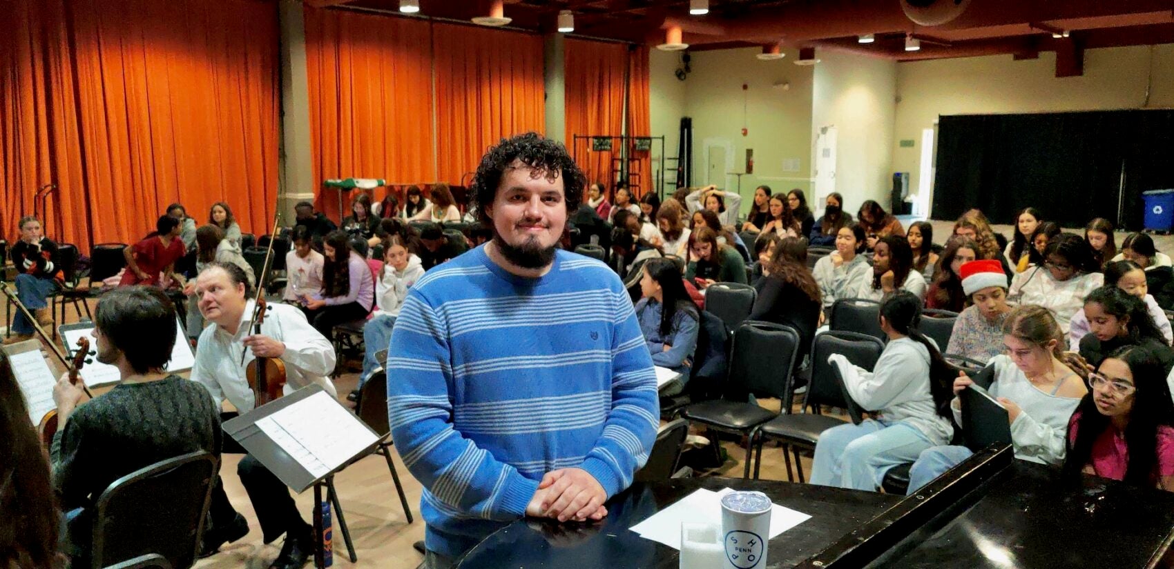 Composer Caleb Etchison stands with the ensemble from the Philadelphia Youth Choral Ensembles