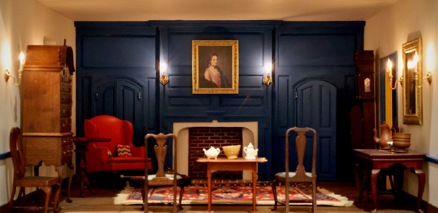 A miniature replica Charles Wilson Peale's portrait of Elizabeth Benezet (1772) hangs in the living room of the Peters-Herdeg dollhouse