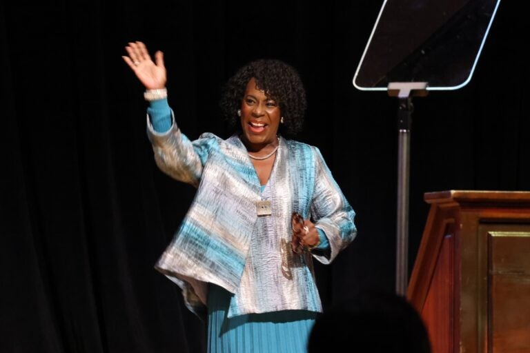 Cherelle Parker waves to the crowd as she walks on stage towards the podium at Temple University to deliver her State of the City address.