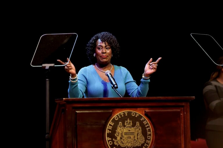 Cherelle Parker is on stage speaking at a podium