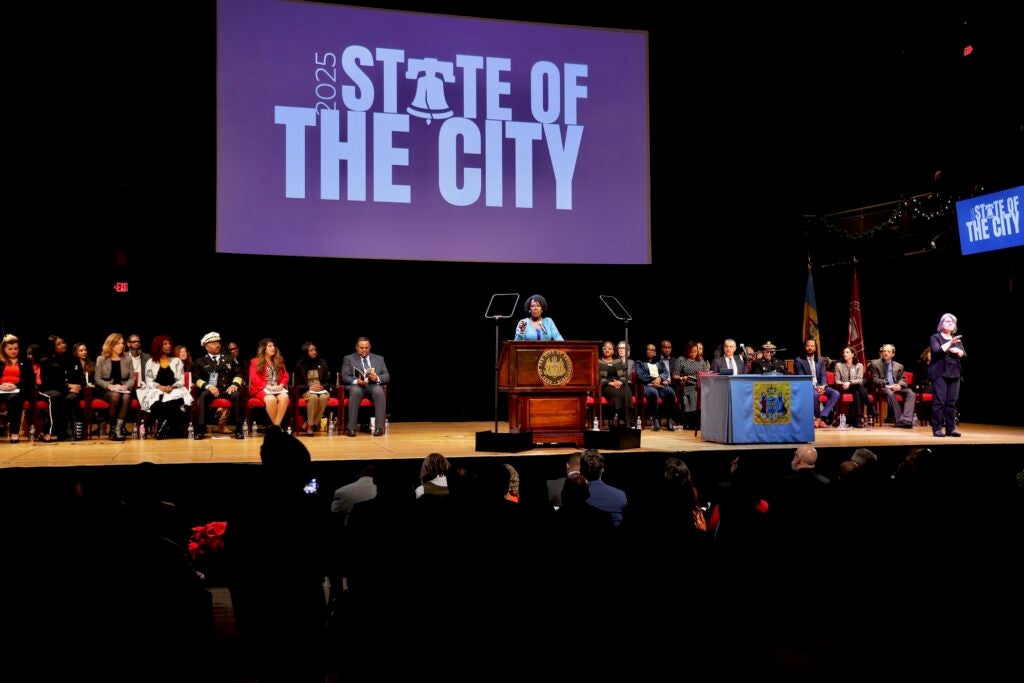 Cherelle Parker is on stage speaking at a podium