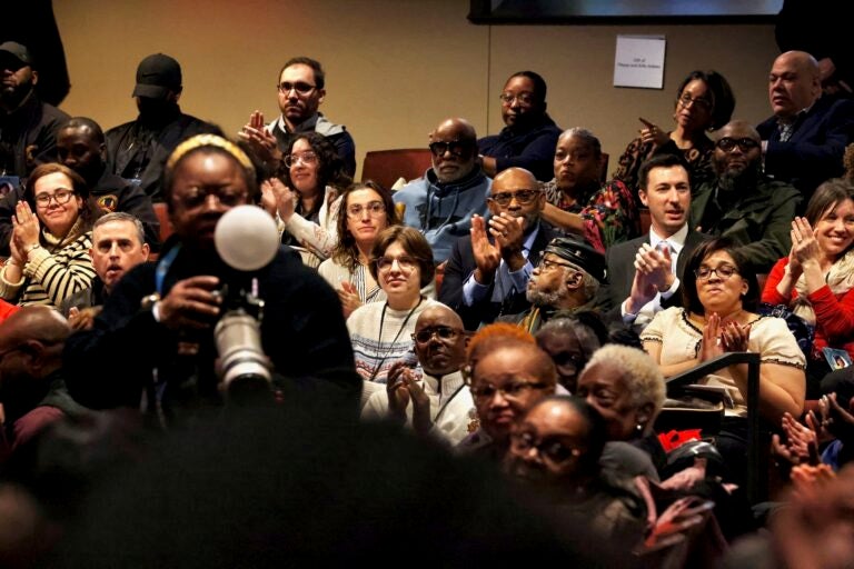 Audience members applaud in the auditorium at Temple University as Cherelle Parker is giving her speech