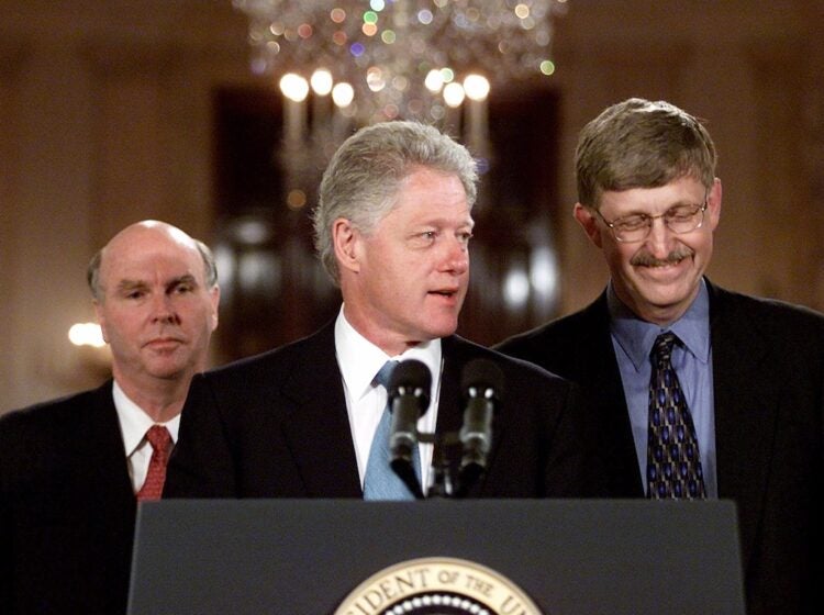 President Clinton, flanked by Celera Genomics head J. Craig Venter, left, and Francis Collins, head of the Human Genome Project of the National Institutes of Health, meets reporters in the East Room of the White House Monday, June 26, 2000 to announce that the two teams have completed a rough draft of the human genetic code. (AP Photo/Rick Bowmer)