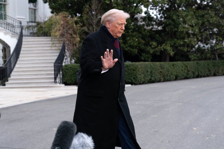 President Donald Trump waves to reporters as he departs from the South Lawn of the White House, Saturday, Dec. 13, 2025. (AP Photo/Jose Luis Magana)